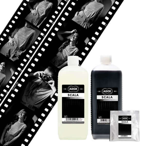 ADOX Scala Reversal Kit with bottles and black and white film negatives for B&W slide processing.