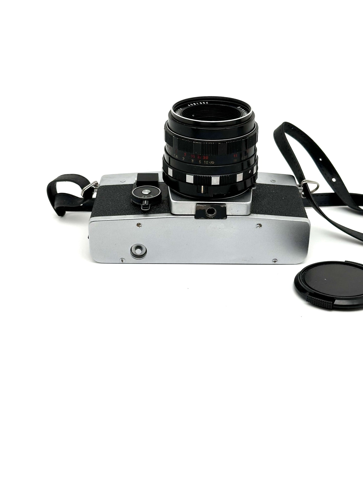 Exakta RTL 1000 vintage 35mm film camera with lens and strap, showcasing classic design by Pentacon.