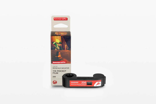 Lomography Lobster Redscale 110 ISO 200 film packaging with black reel, ideal for vibrant sun-kissed photography.
