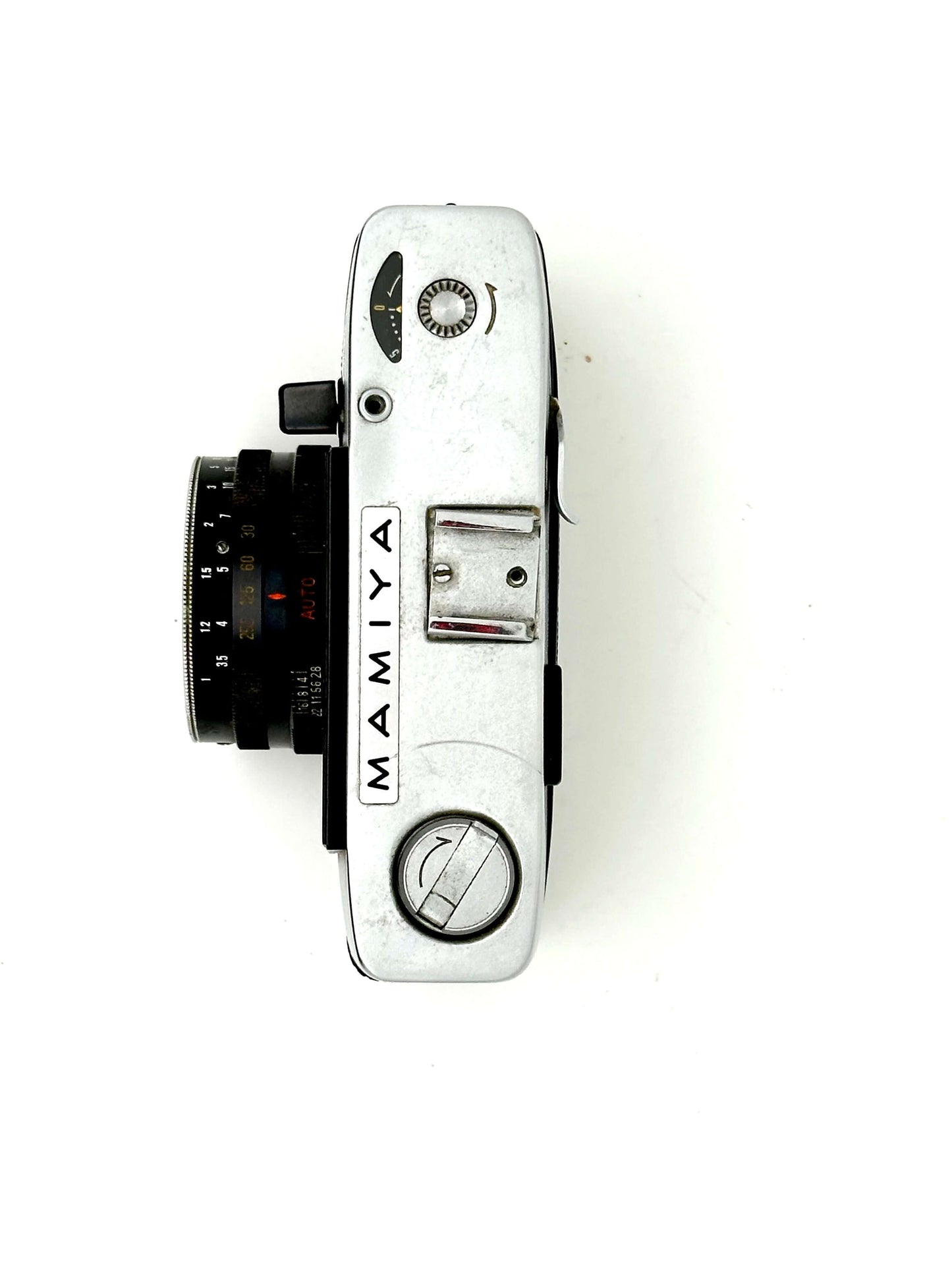 Mamiya Kominar vintage rangefinder camera top view showcasing 40mm f2.8 lens and manual controls.