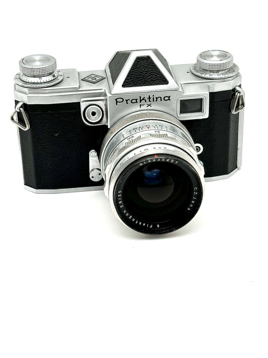 Praktina FX vintage 35mm film camera with CZJ Flektogon 35mm f2.8 lens, showcasing classic design and wear.