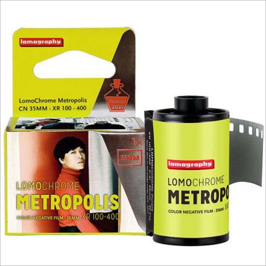 Lomography LomoChrome Metropolis Color 100-400 ISO 35mm film roll and packaging with vibrant design.