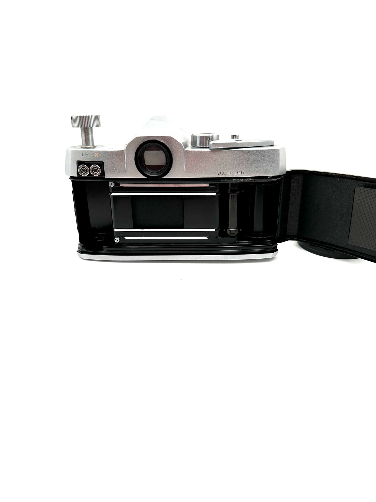 Rear view of an open vintage Mamiya film camera showcasing the film slot mechanism.