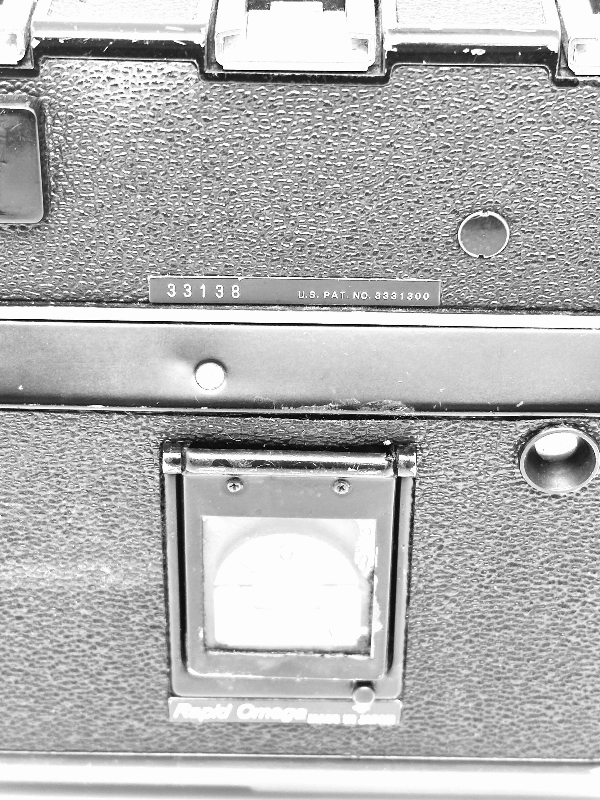 Close-up of the Koni Rapid Omega 100 6x7 Film Camera back showing serial number 33138