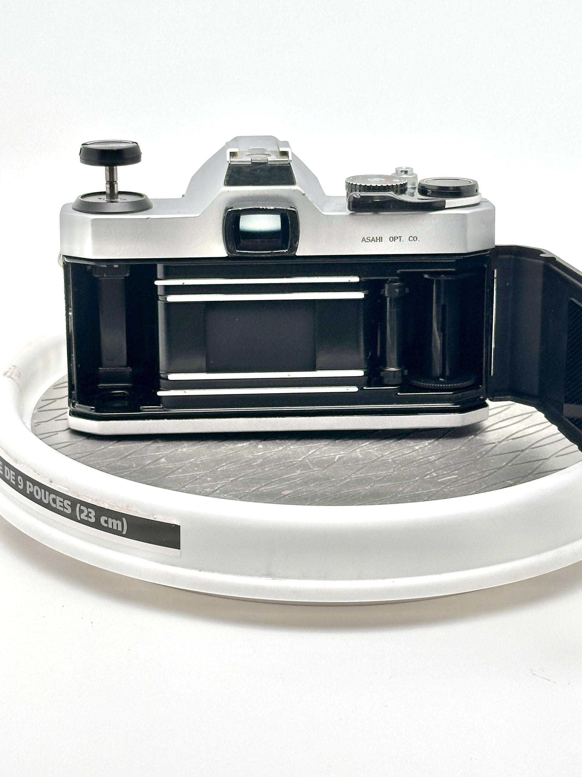 back view of a Japanese Asahi Pentax K1000 35mm film camera on a display turntable