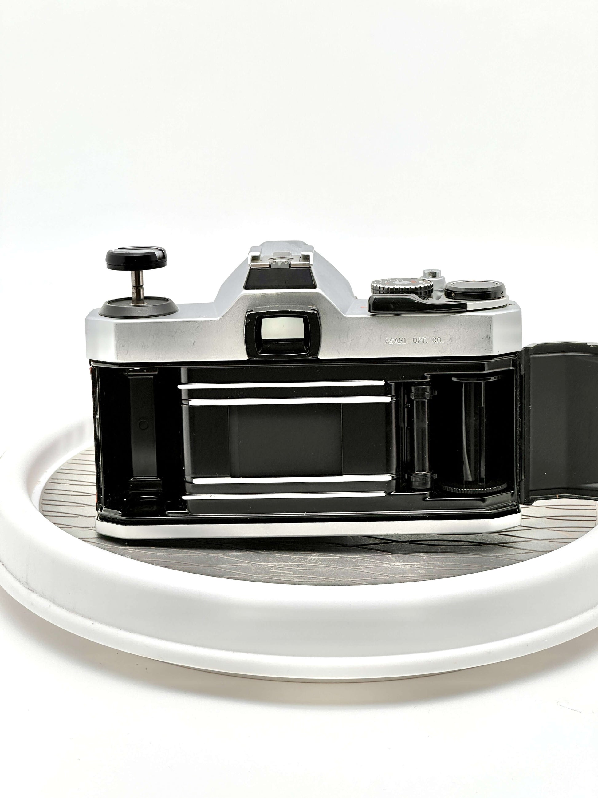 Back view of a Japanese Asahi Pentax K1000 35mm film camera, showcasing its classic design and film compartment.