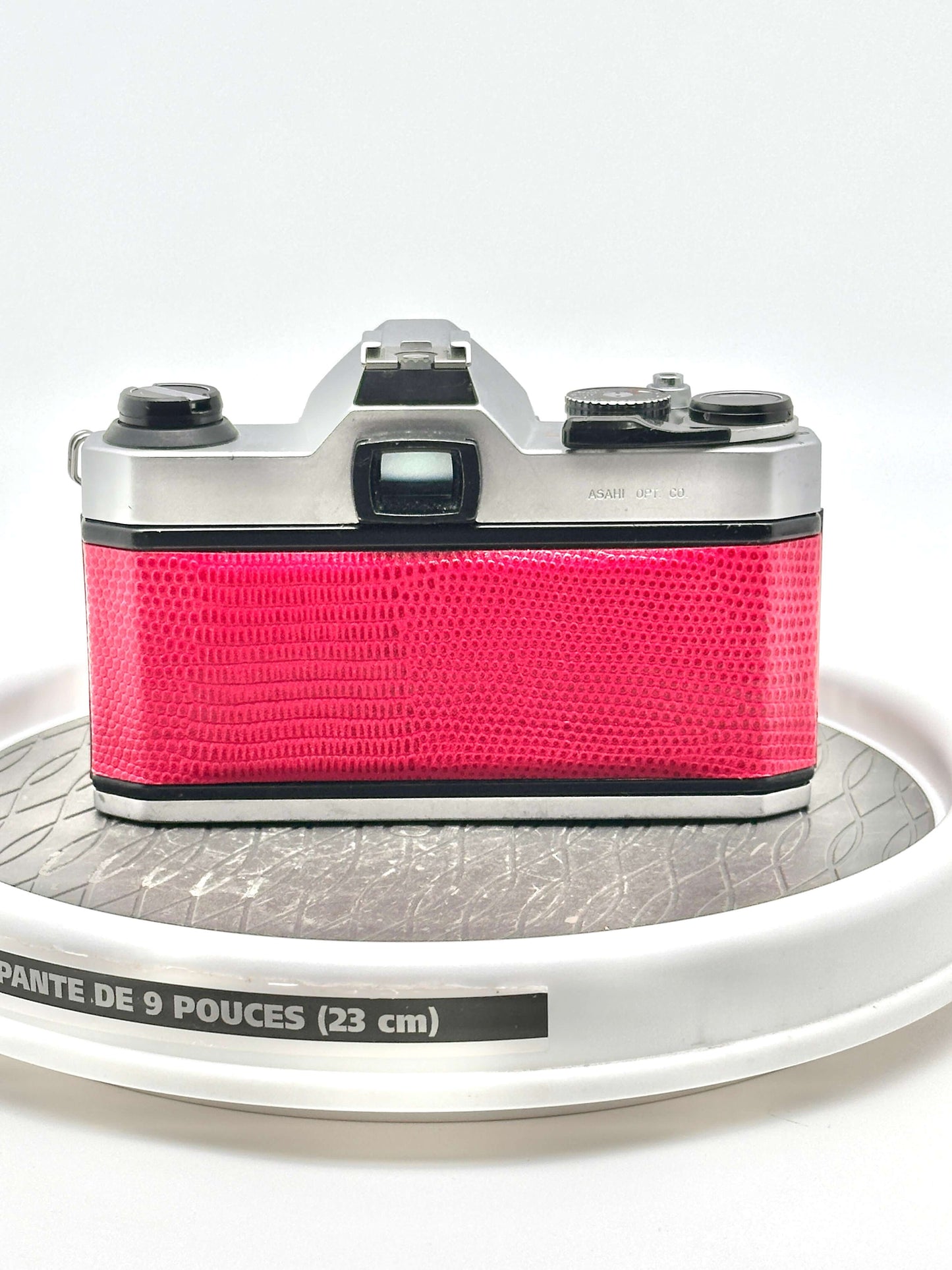 Japanese Asahi Pentax K1000 used 35mm film camera in red, showcasing its iconic design and reliability.