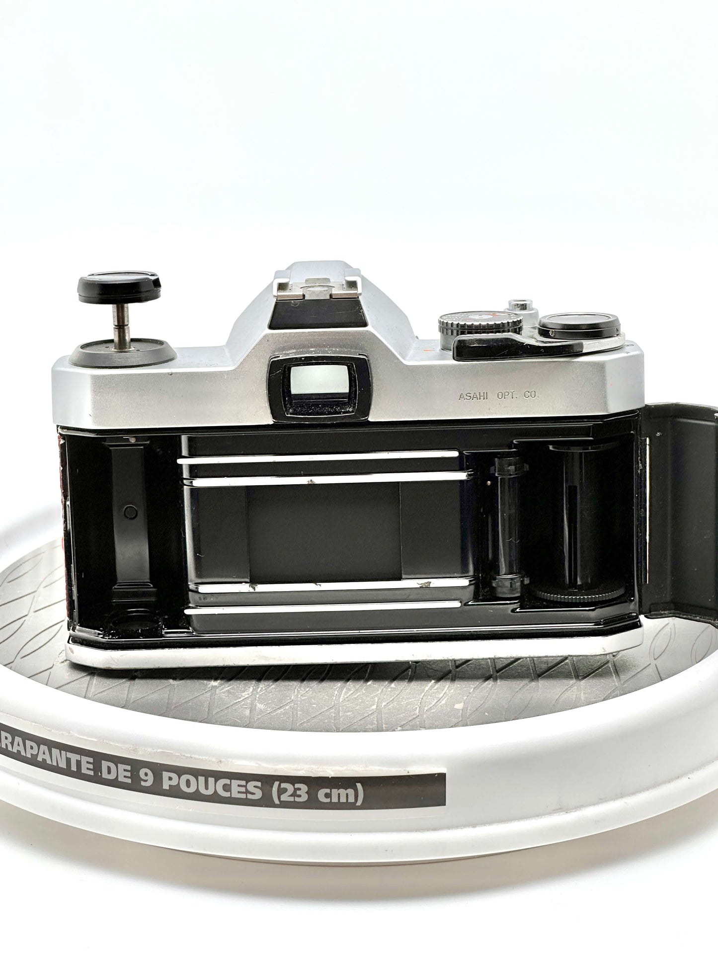 Back view of a used Japanese Asahi Pentax K1000 35mm film camera showcasing its interior and film compartment.