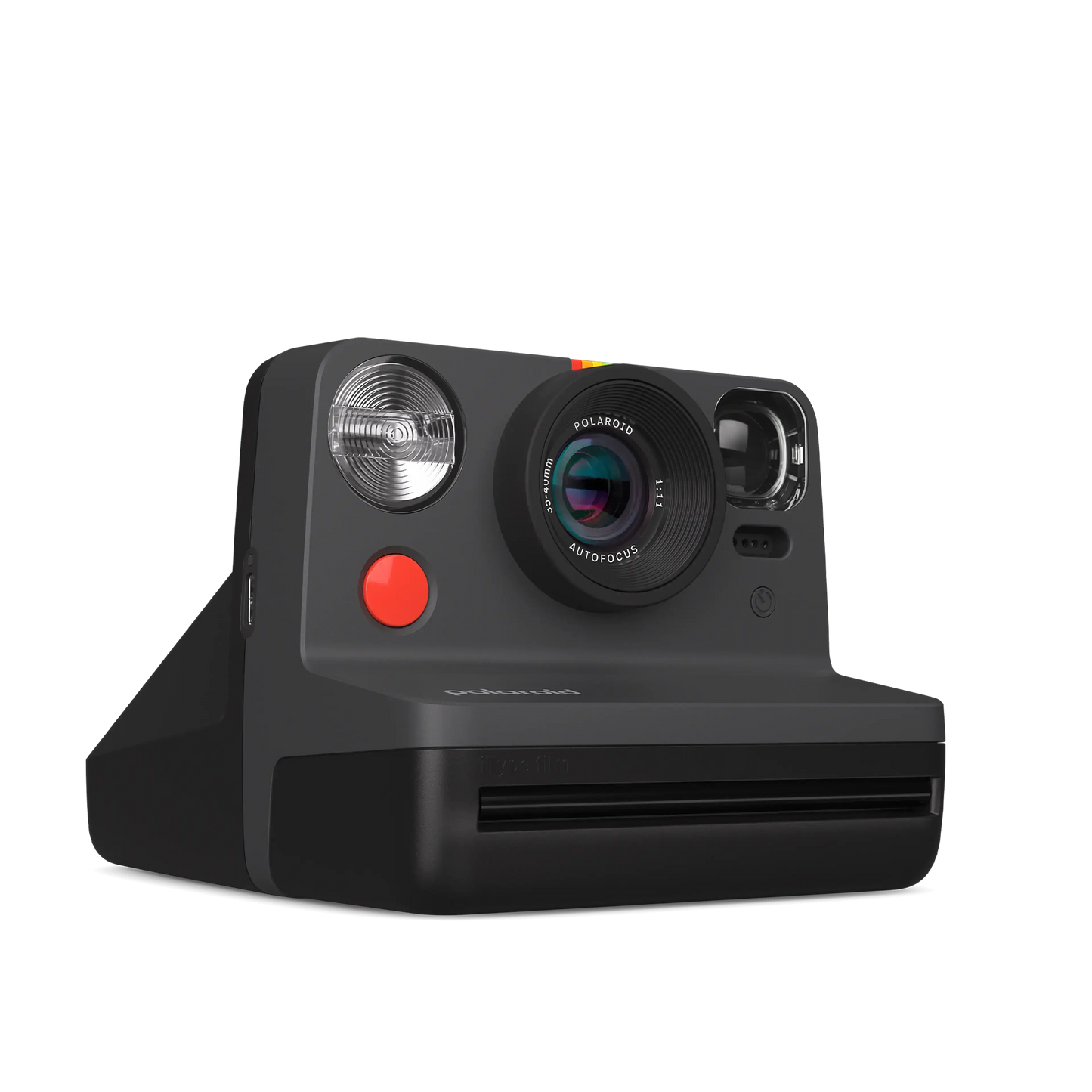 Vintage black instant camera with rainbow detailing and red button.