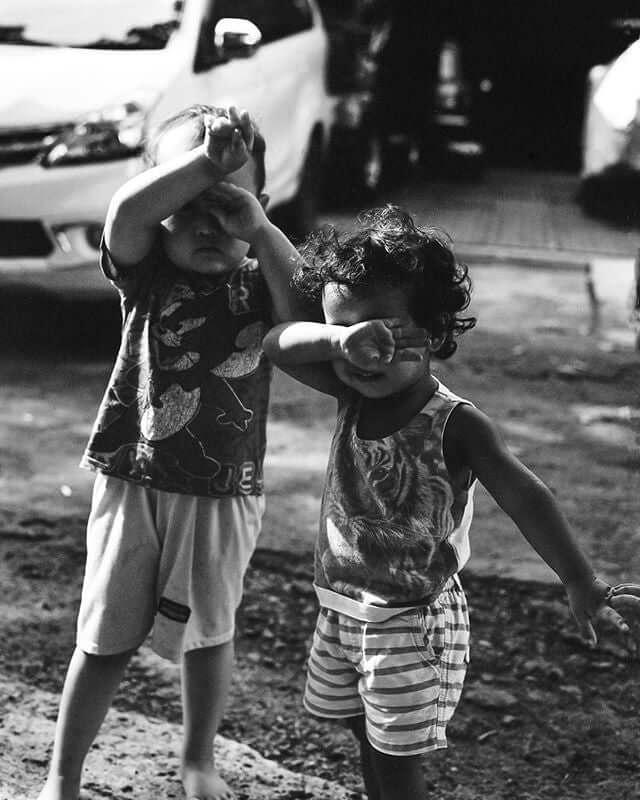 Two young kids covering their face shot on Rollei Retro 400S BW 35mm, 36 Exp Film