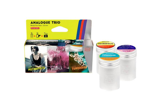 Analogue Trio Mixed Film Pack 35mm with Metropolis, Purple, and Turquoise films in tins against a white background.