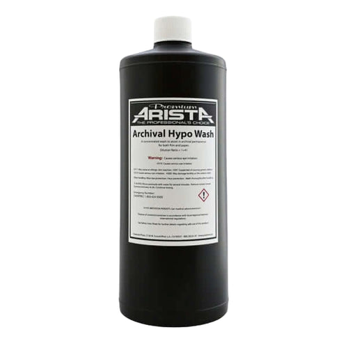 Black plastic bottle with white cap and label reading ’premium arista archival hypo wash.’