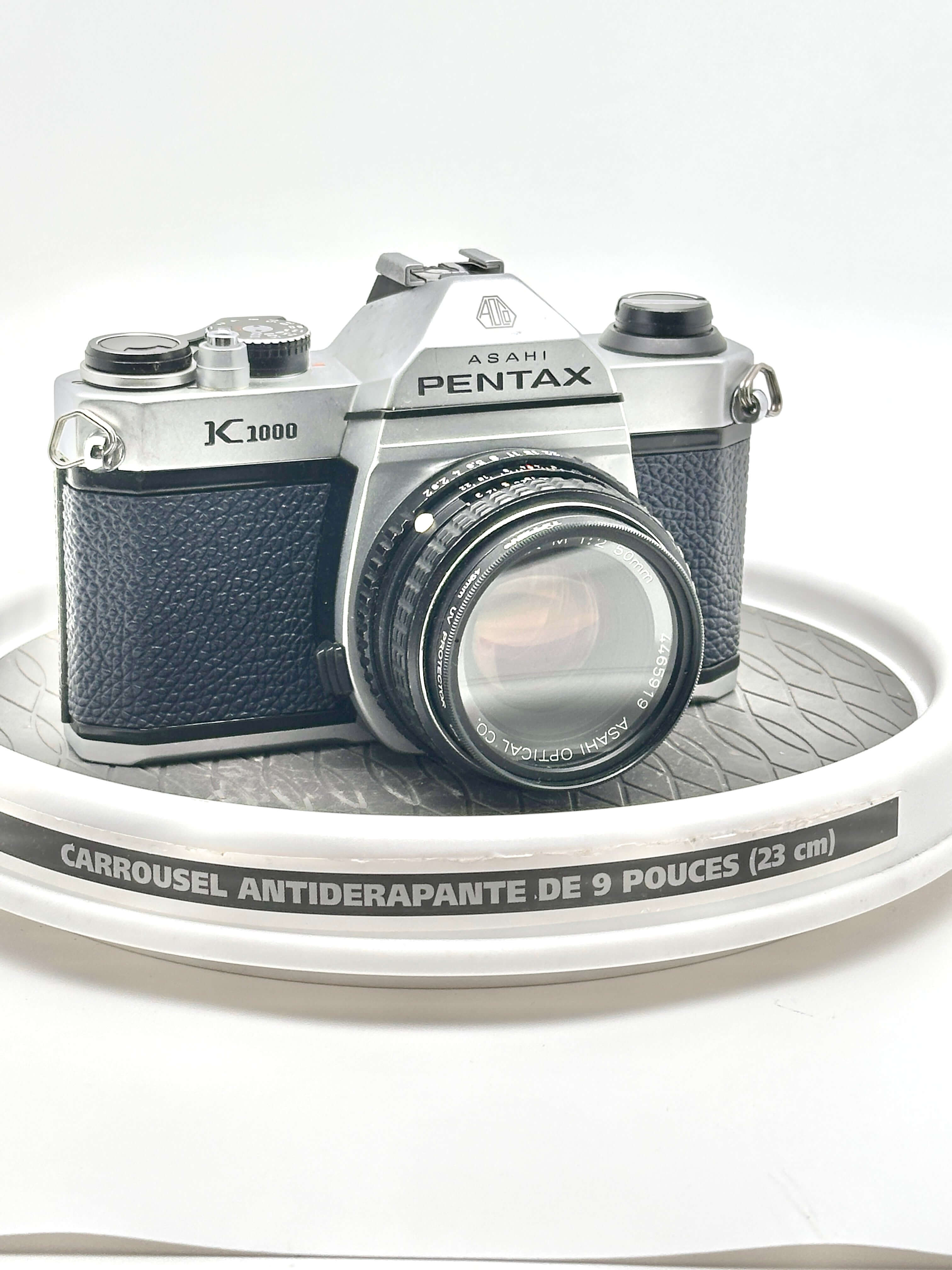 Japanese Asahi Pentax K1000 used 35mm film camera with 50mm f2 lens on display.