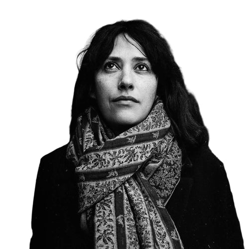 A patterned scarf with intricate floral and geometric designs, wrapped around the neck.