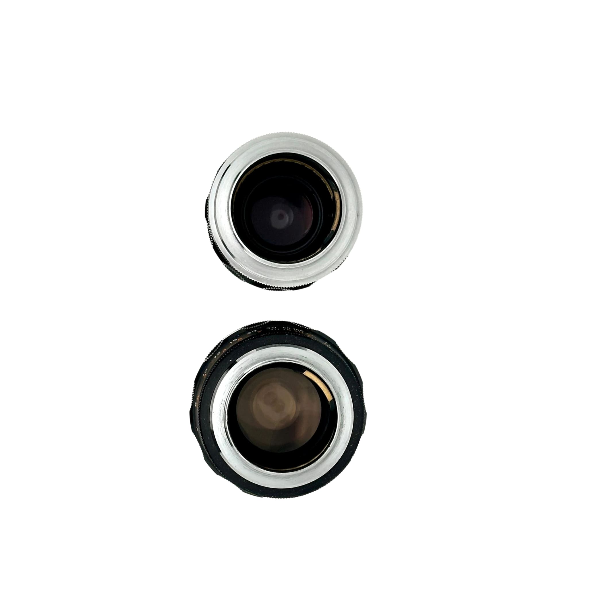 Two vintage camera lenses, one with a silver metallic rim and the other in black rubberized housing.