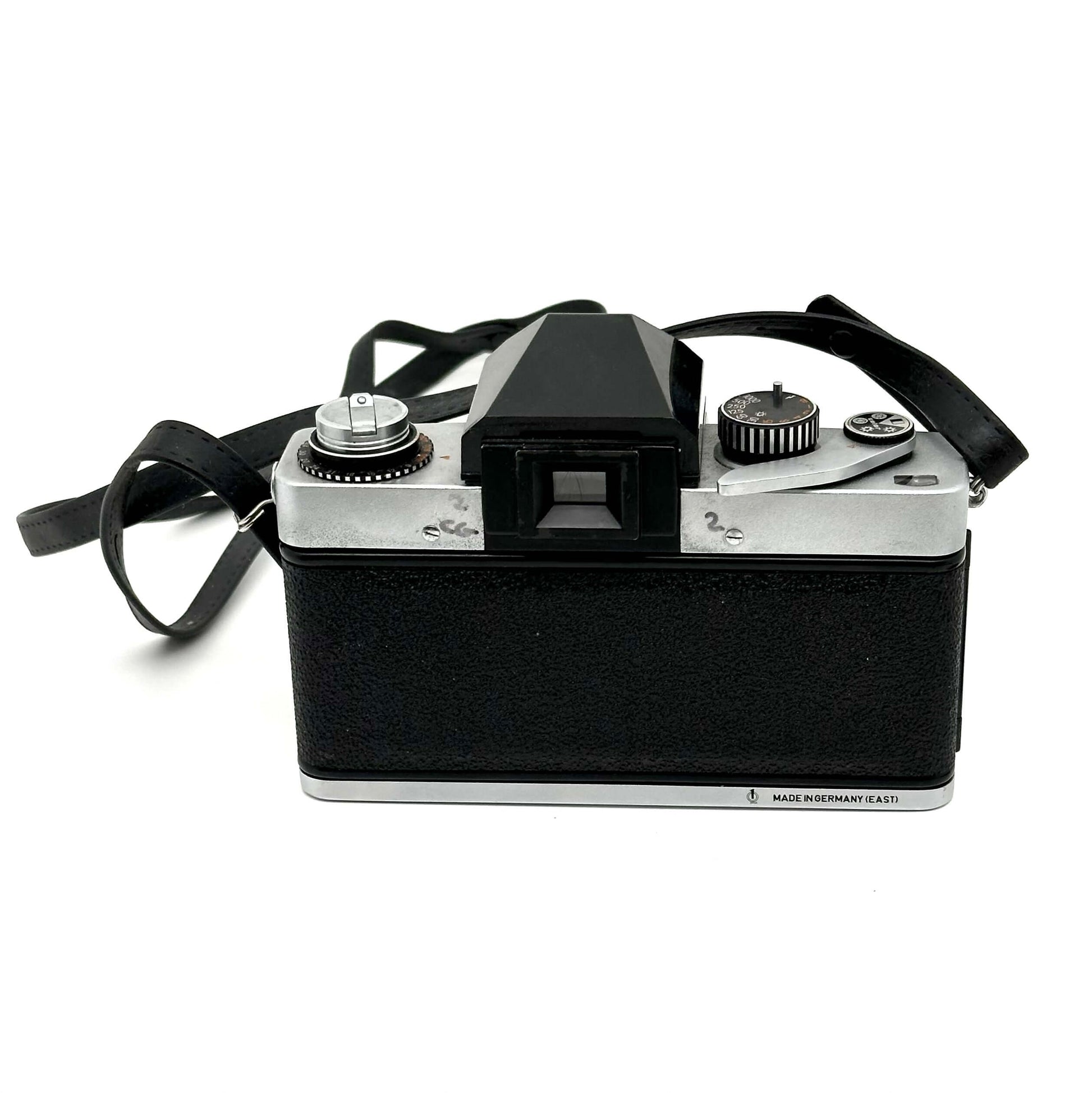Exakta RTL 1000 vintage 35mm film camera with a classic design, featuring a bayonet mount and viewfinder.