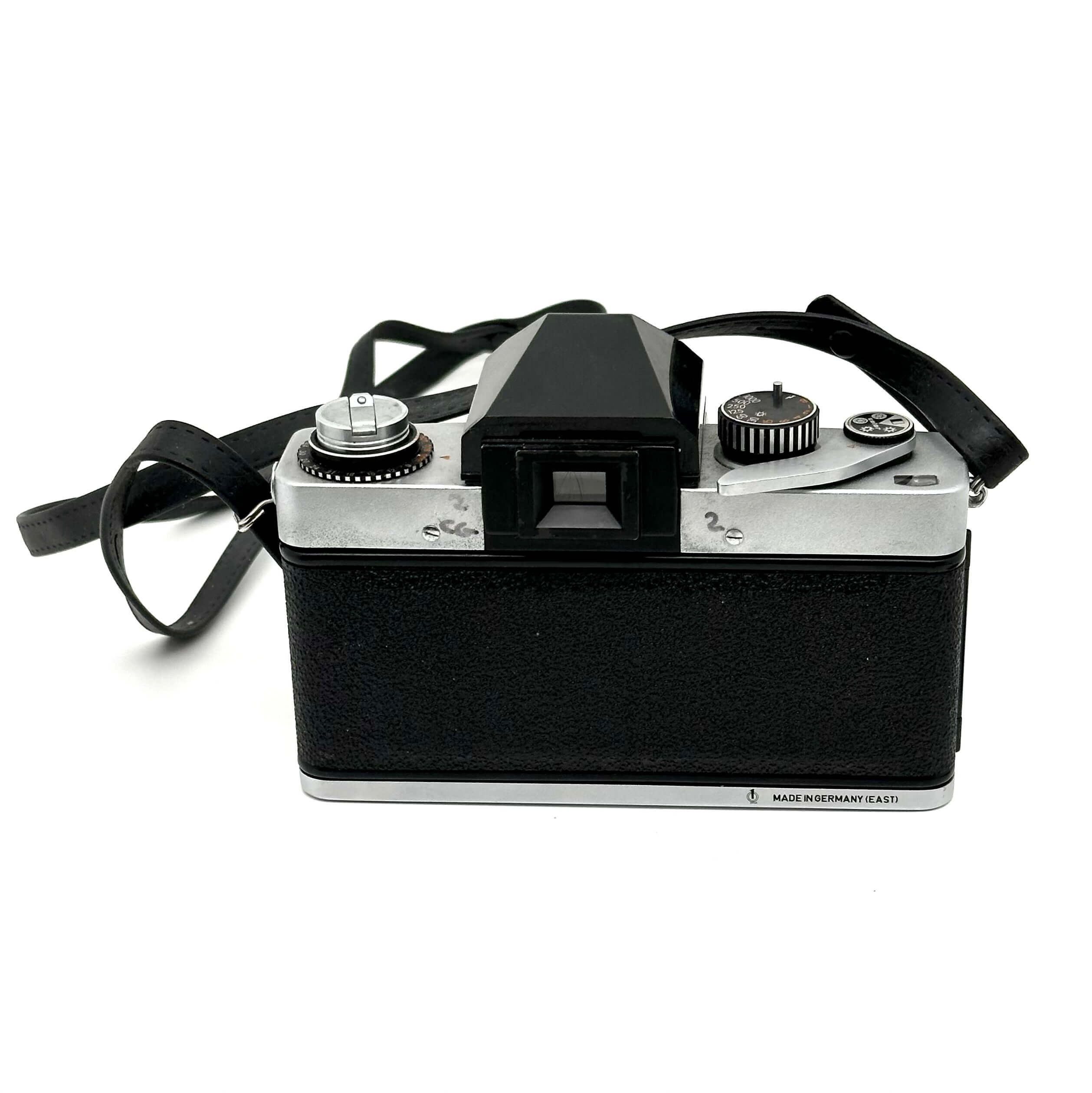 Exakta RTL 1000 vintage 35mm film camera with a classic design, featuring a bayonet mount and viewfinder.