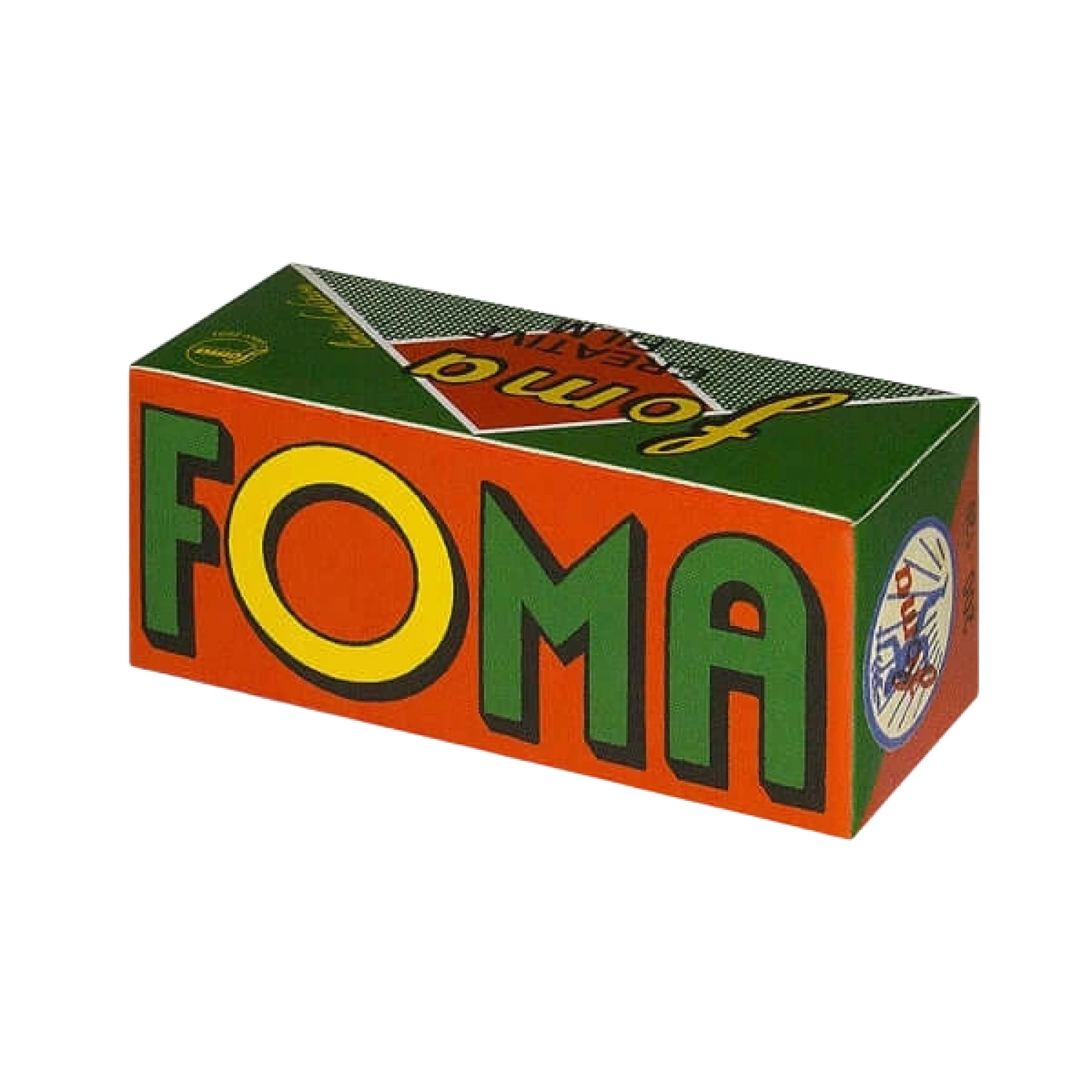 Vibrant orange and green cardboard box with bold yellow-green ’foma’ lettering, featuring a retro design and circular logo on the side.