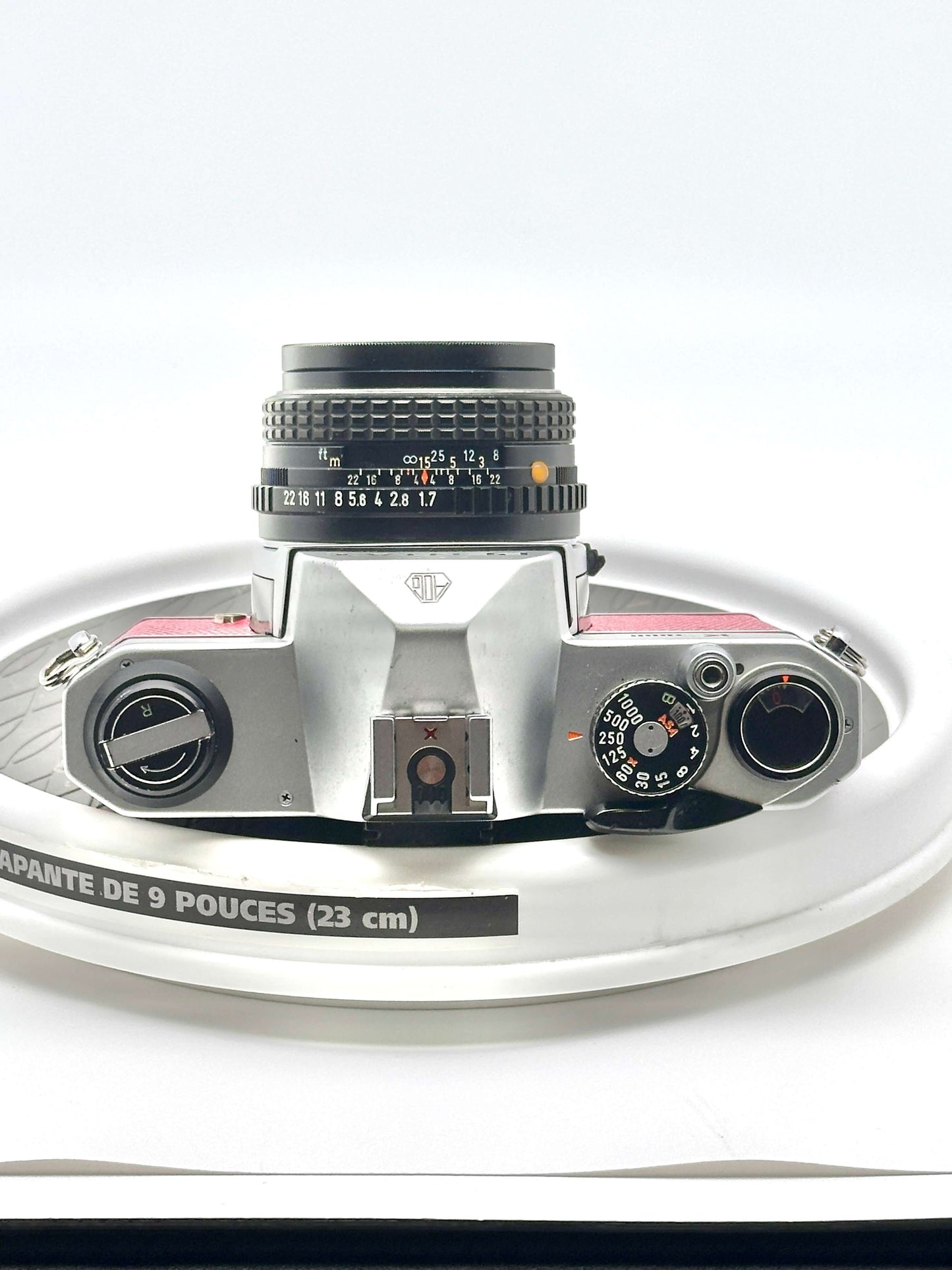 Top view of Japanese Asahi Pentax K1000 35mm film camera with 50mm f1.7 lens, showcasing controls and iconic design.