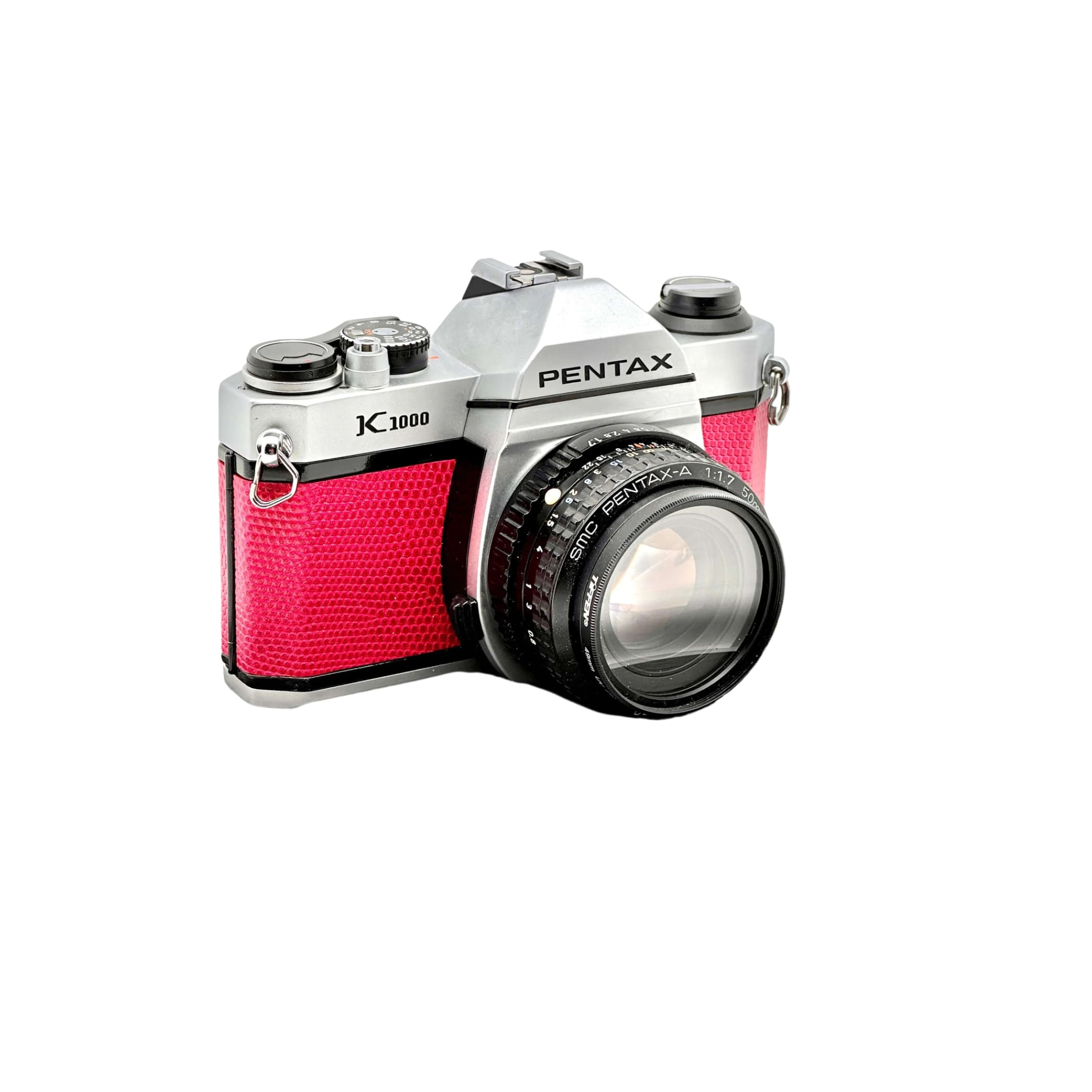 Silver and red textured leather pentax k1000 film camera with a black lens.