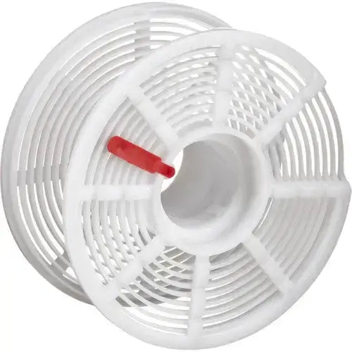 Spiral plastic film reel with a red clip for 35mm film processing.