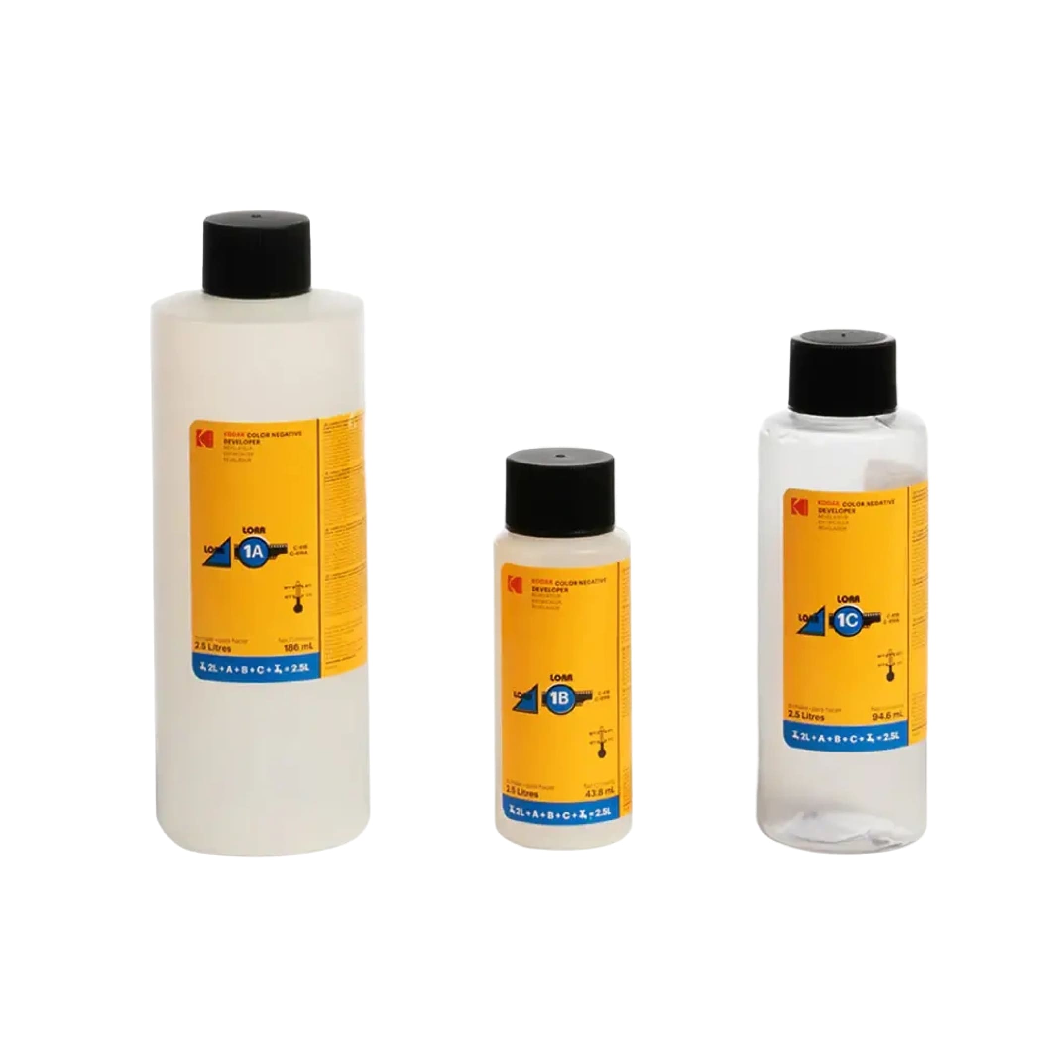 Three transparent plastic bottles with black caps and bright yellow labels, each containing a clear liquid.