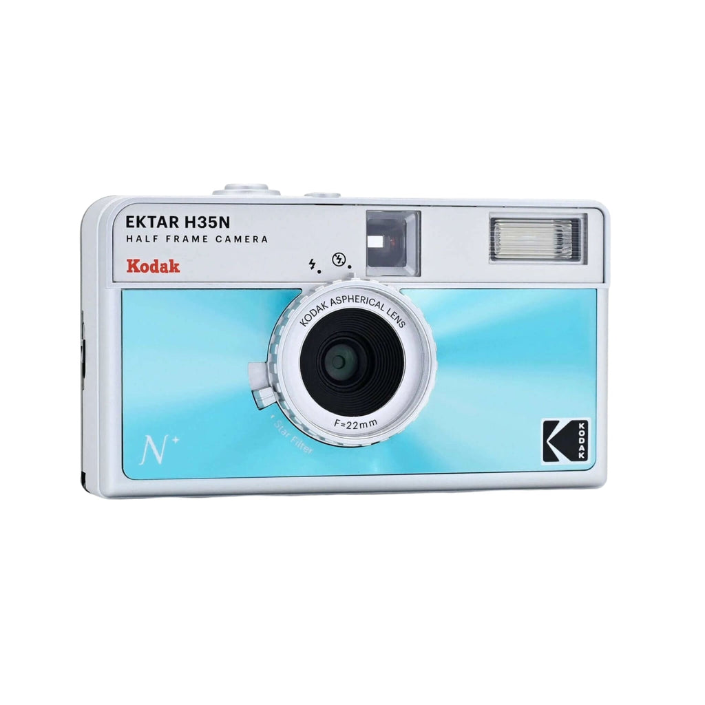 A sleek silver and light blue kodak ektar h35n half-frame camera with a circular lens marked f=22mm.