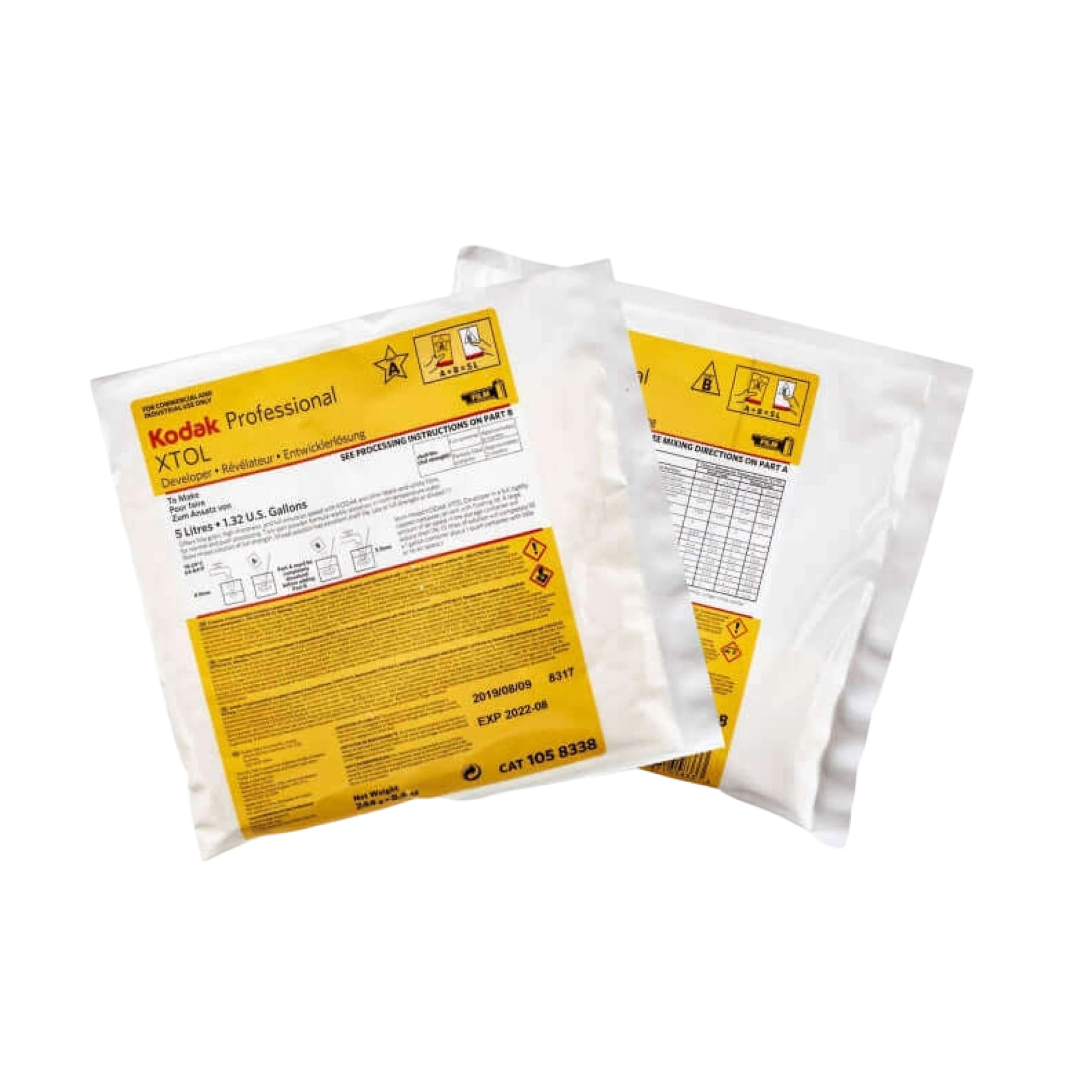 Kodak professional xtol developer packets in white plastic packaging with prominent yellow labeling.