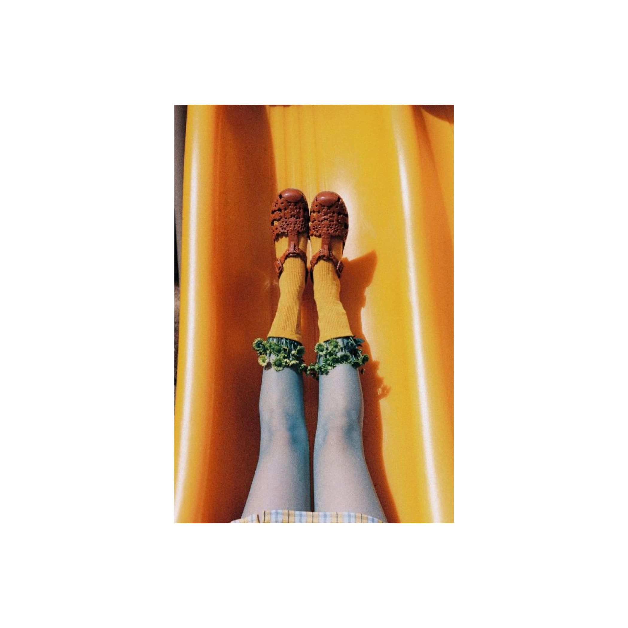 Brown crocheted sandals with a textured, intricate pattern.