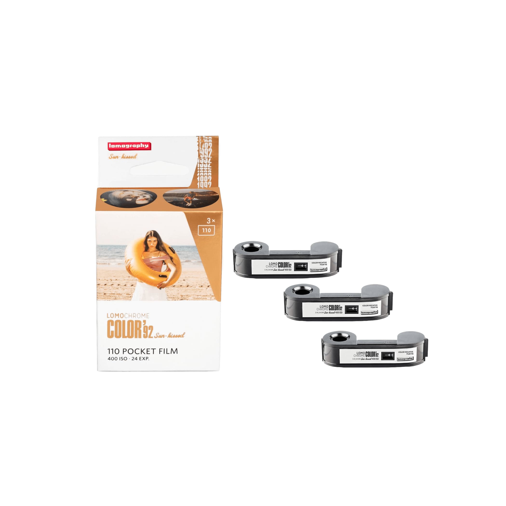 Lomography color 32 sun-kissed 110 pocket film in a white and orange box with three black film reels beside it.