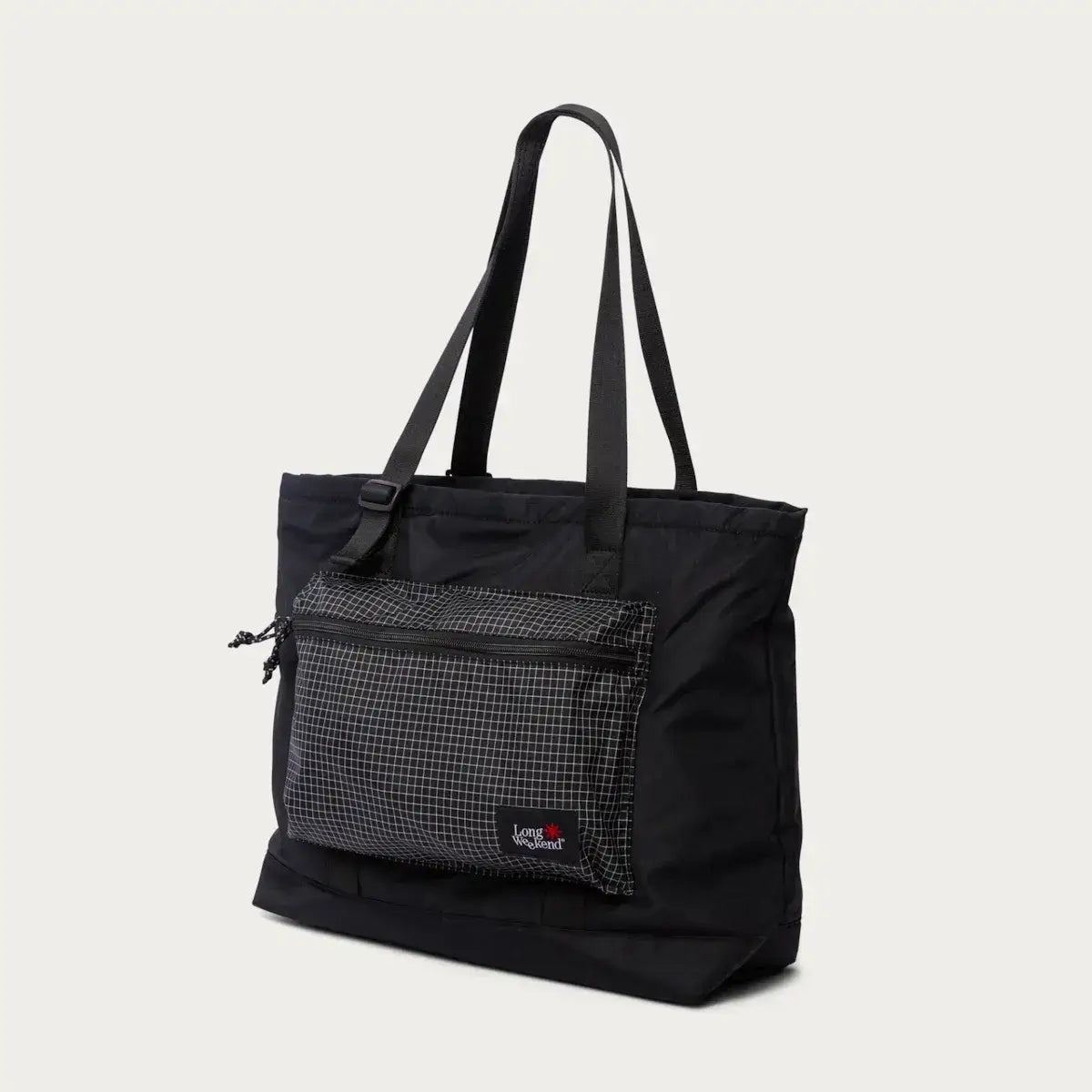 Stylish black tote bag with front zippered pocket featuring a checkered pattern and durable shoulder straps.