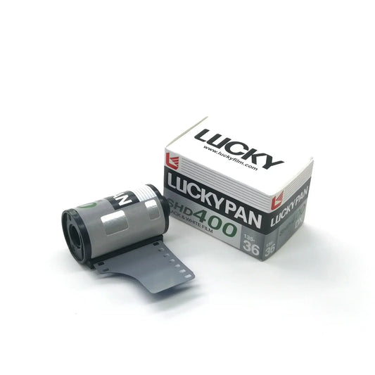 Lucky SHD 400 DX black and white film roll with packaging, ideal for analog photography enthusiasts.