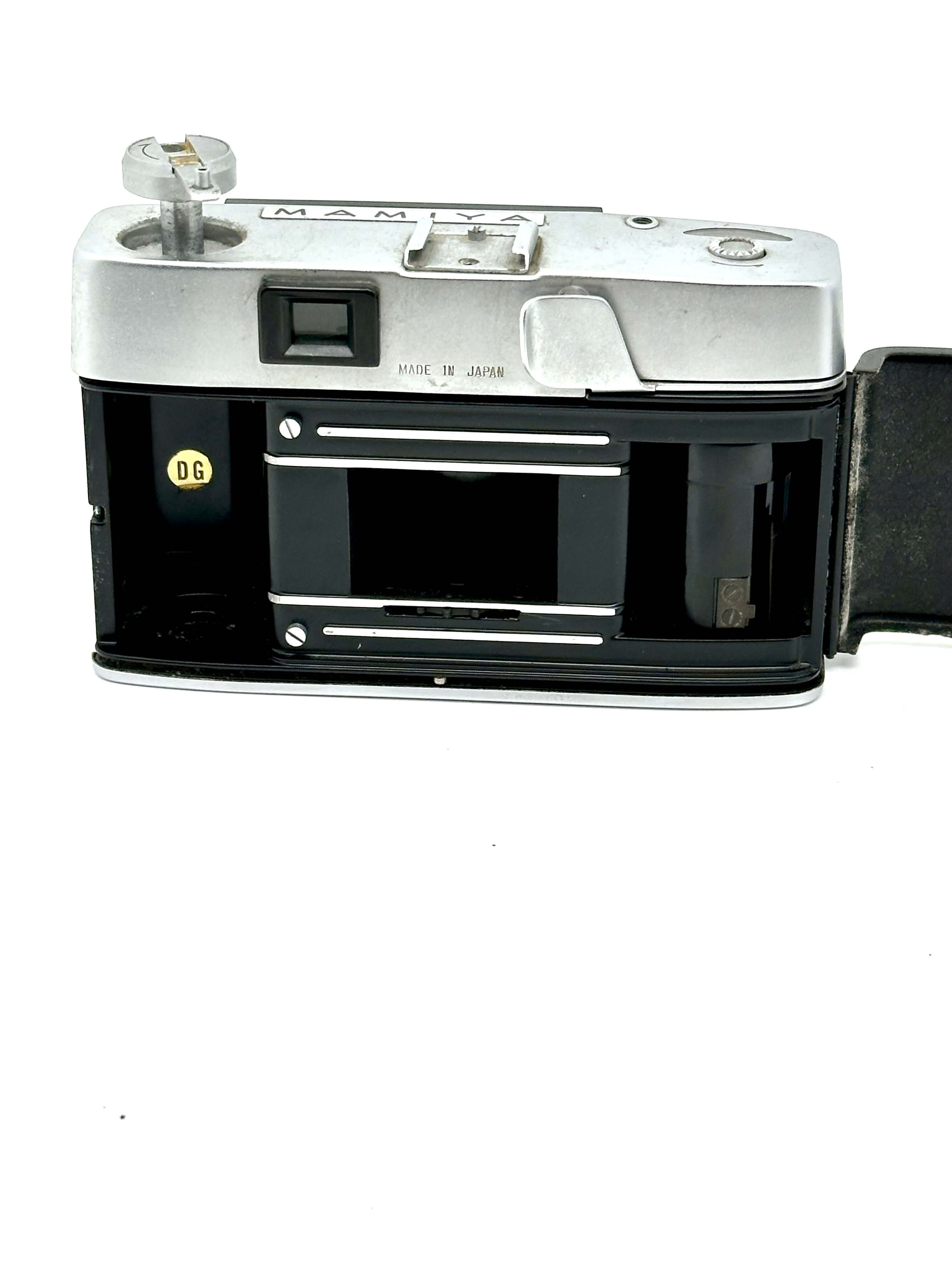 Mamiya Kominar vintage rangefinder 35mm film camera, showing rear view and film compartment.