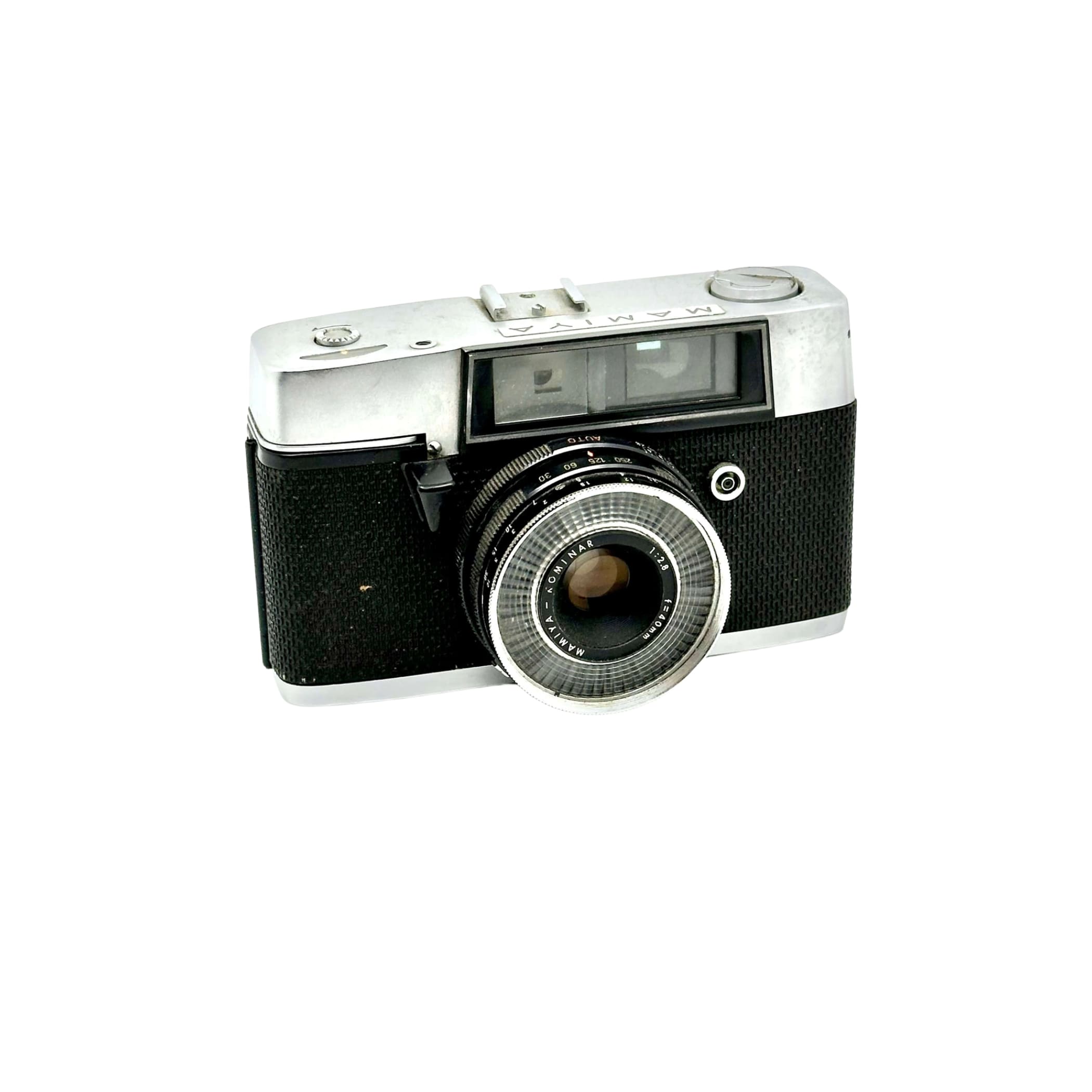 Silver and black mamiya film camera with a textured grip and chrome lens ring.