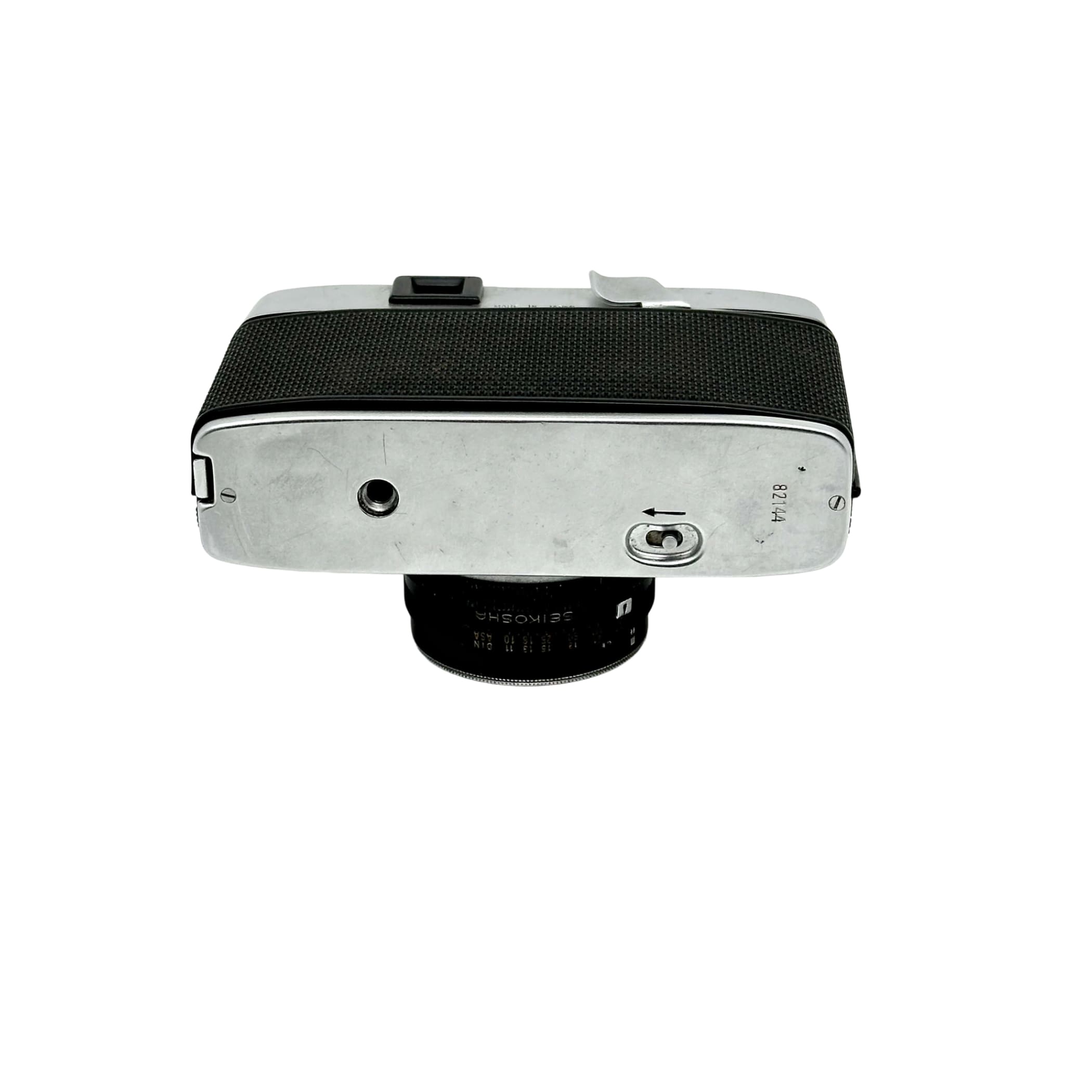 Silver-bodied rangefinder camera with black textured grip and a 35mm lens.