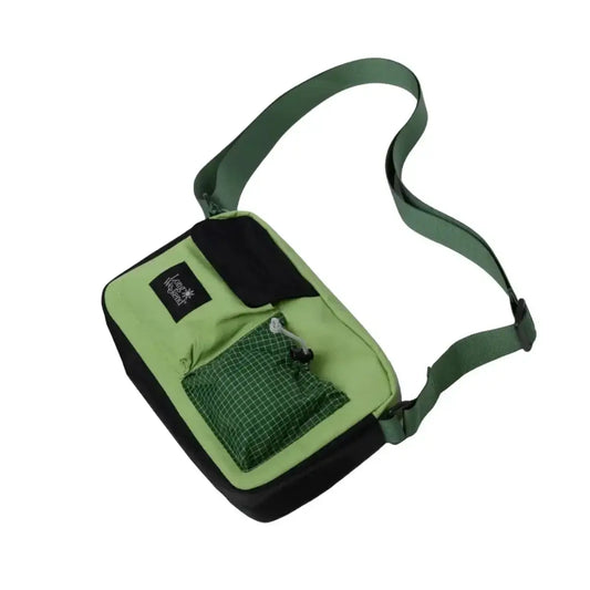 Green crossbody bag with adjustable strap and multiple pockets for everyday use.