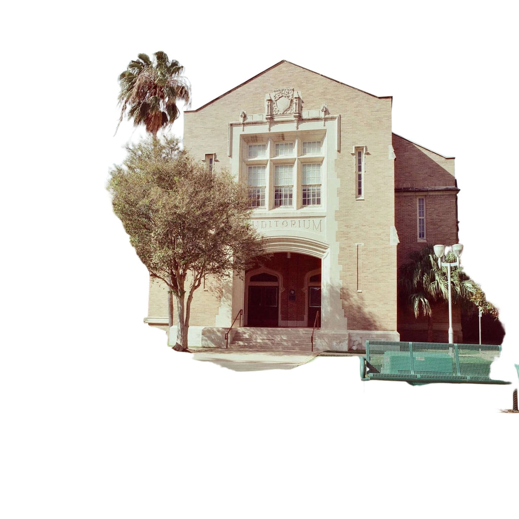 Beige brick building with arched entrance and white stone trim, featuring the word ’editioum’ above it.
