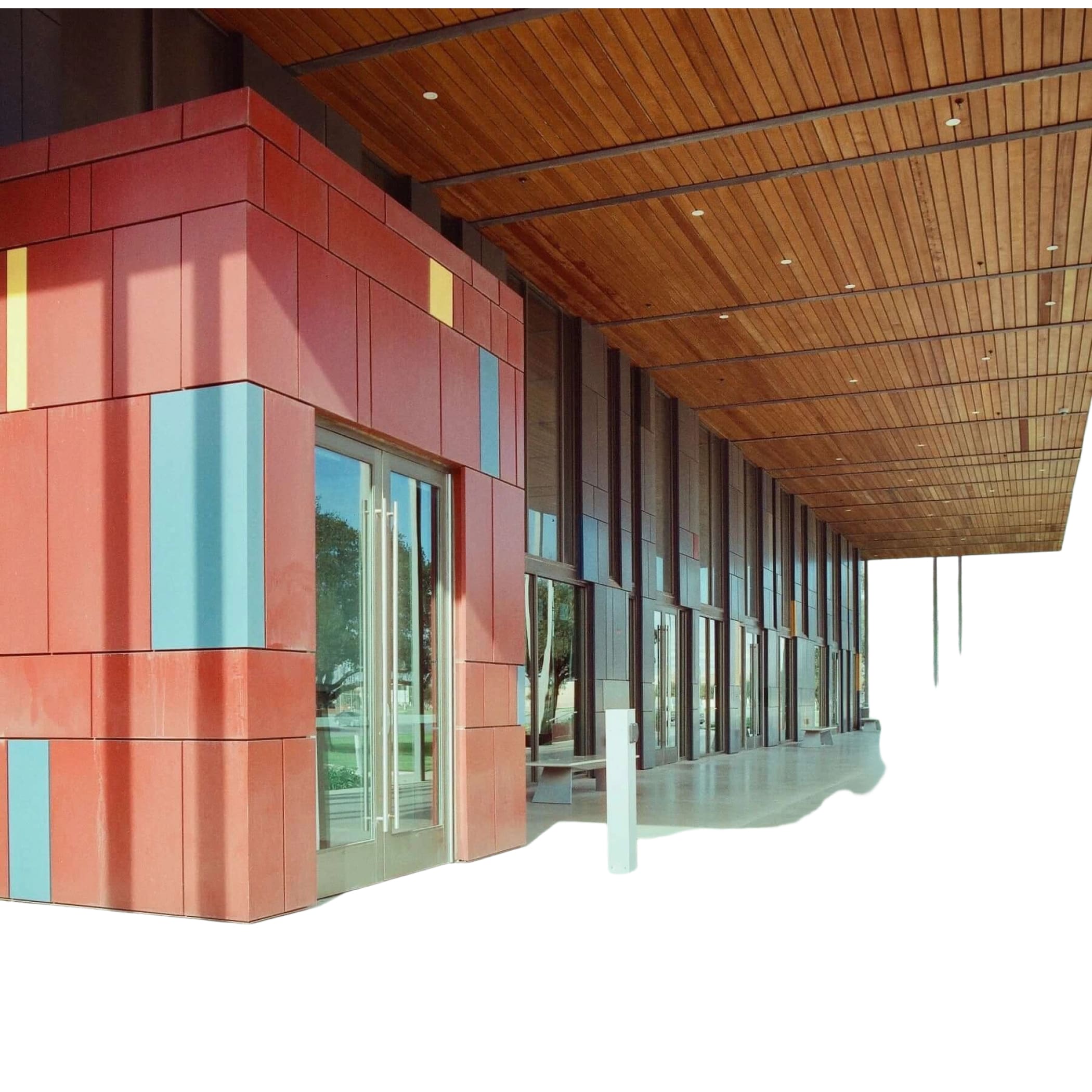 The building features a modern facade with bold red, blue, and yellow panels arranged in geometric patterns.