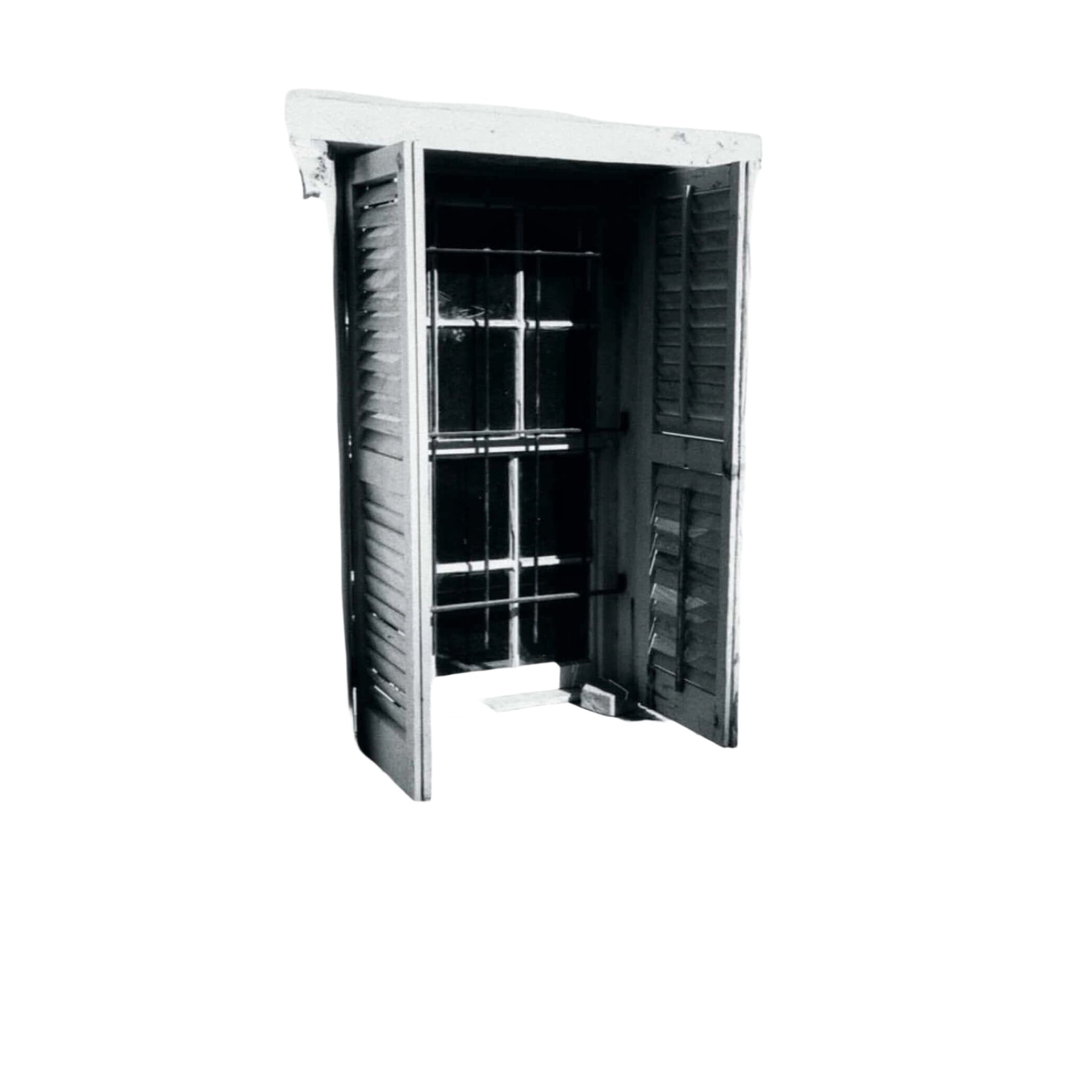 Open wooden shutters with vertical slats frame a window with metal bars, set against a weathered wall.