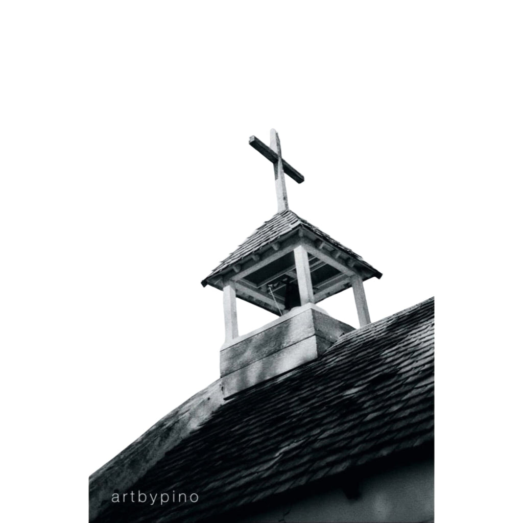Wooden bell tower with a cross on top
