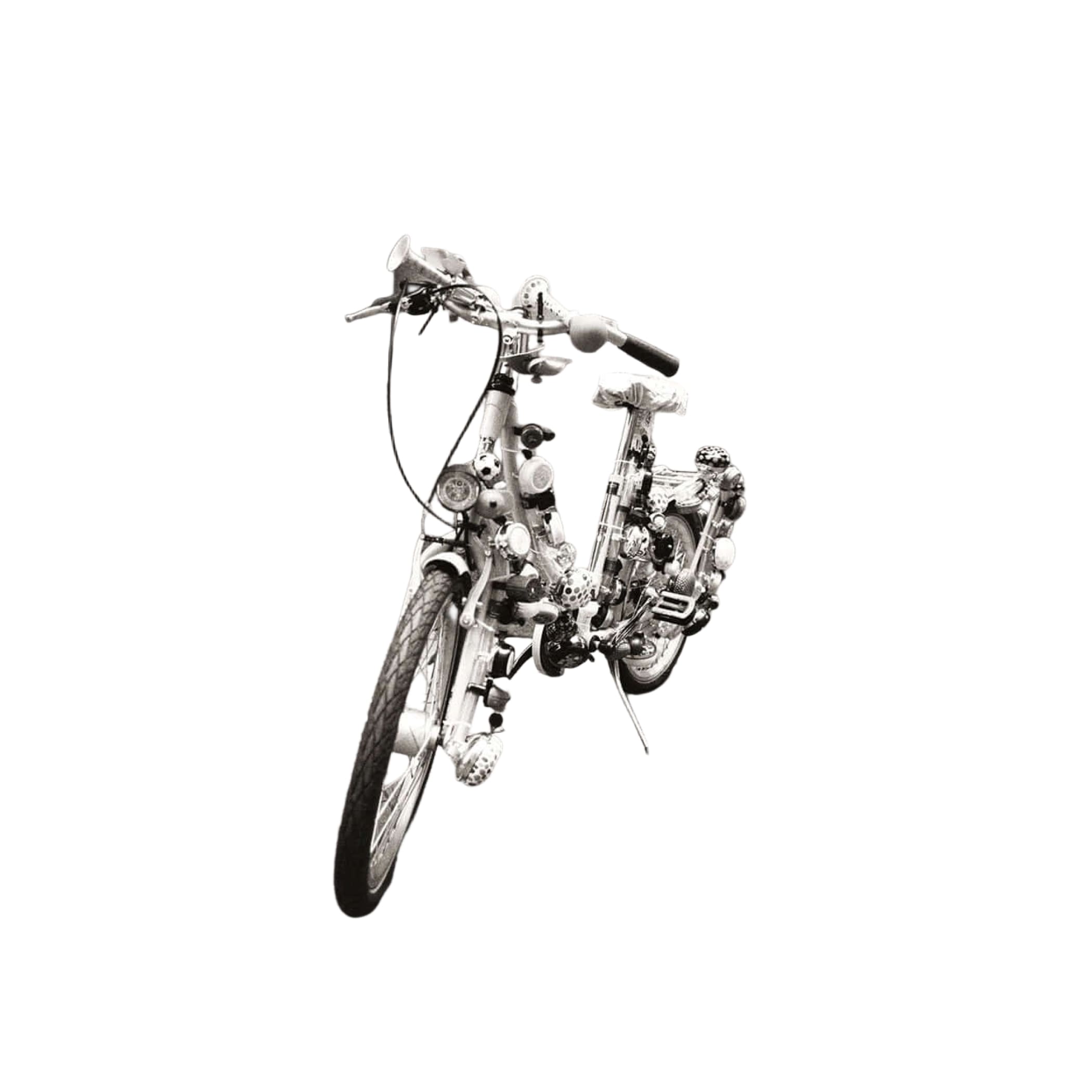 A whimsical, heavily modified bicycle with a chrome frame and handlebars adorned with various mechanical parts.