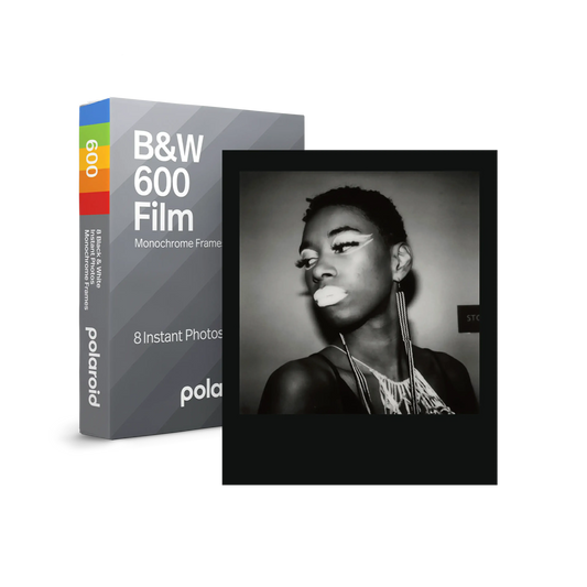 Polaroid B&W 600 film pack and monochrome instant photo of a person with dramatic makeup and earrings