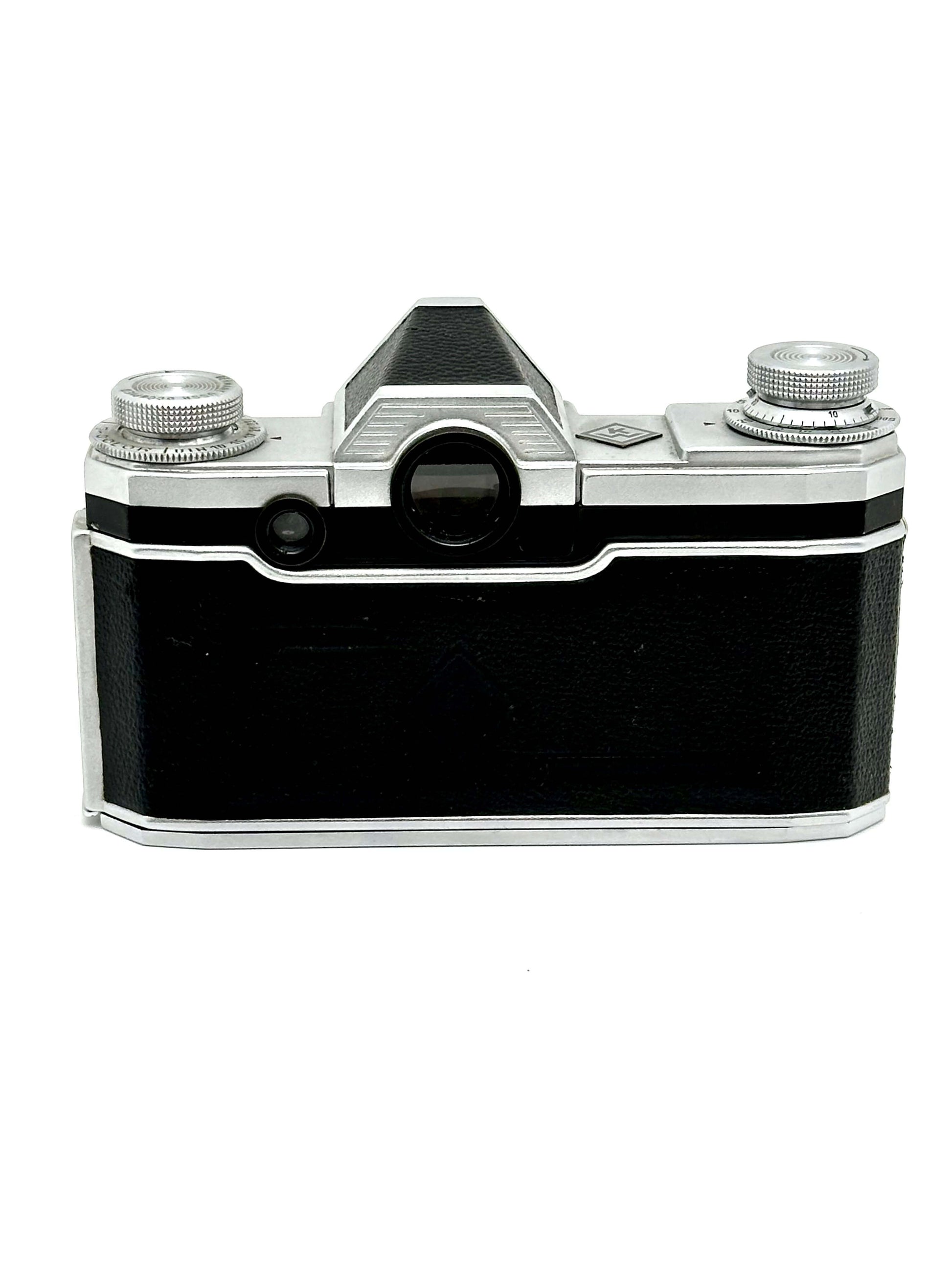 Praktina FX vintage 35mm film camera body with silver and black finish, showing wear and tear, sold as is.