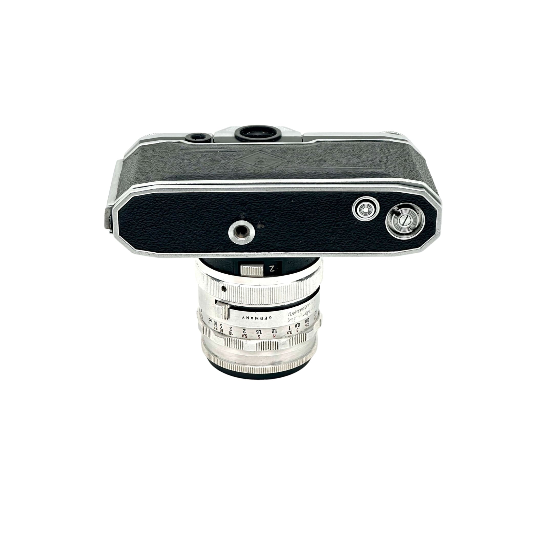 Silver and black leica camera body with a matching silver lens mounted on top.
