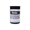 Black cylindrical canister of rollei blackbird creative high contrast black and white film.