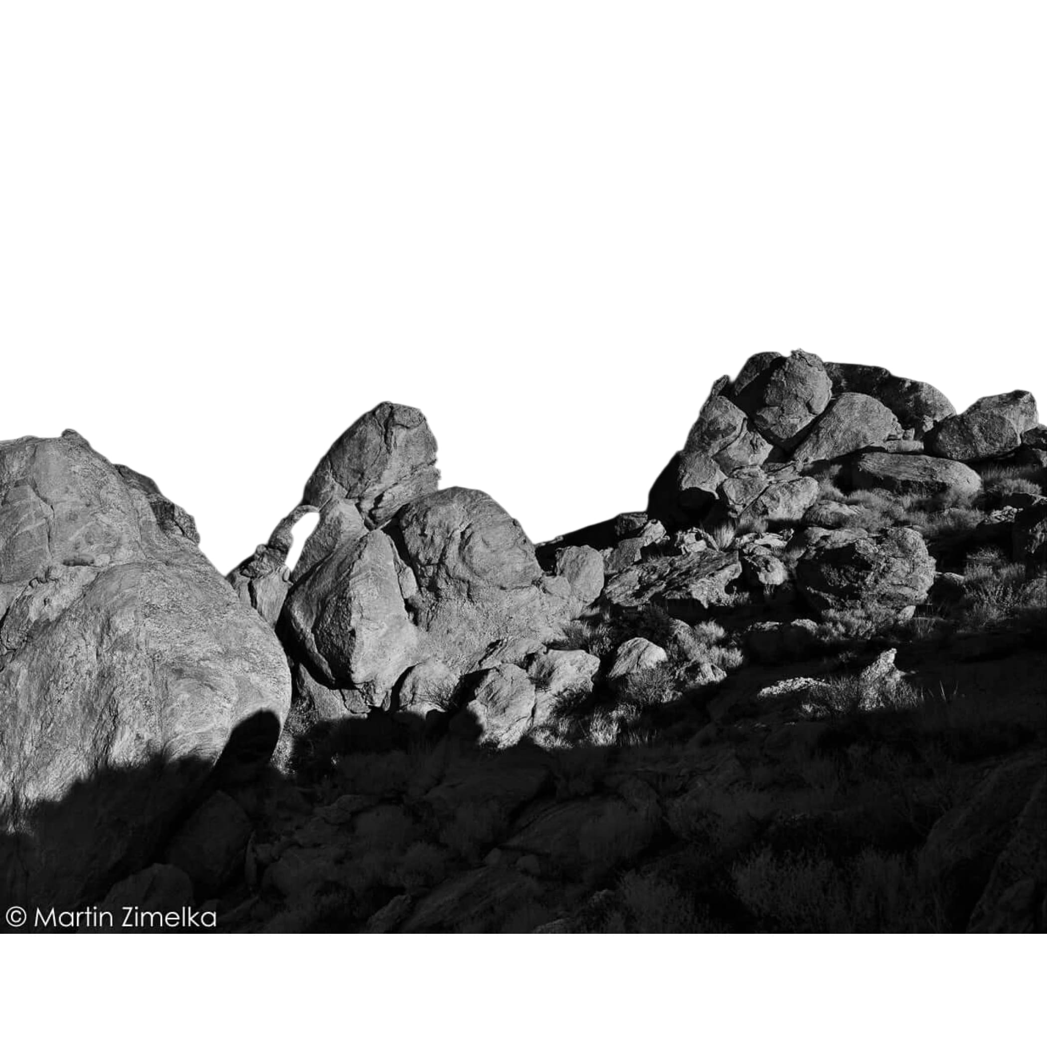 Rugged, unevenly shaped rocks with textured surfaces and sharp edges.