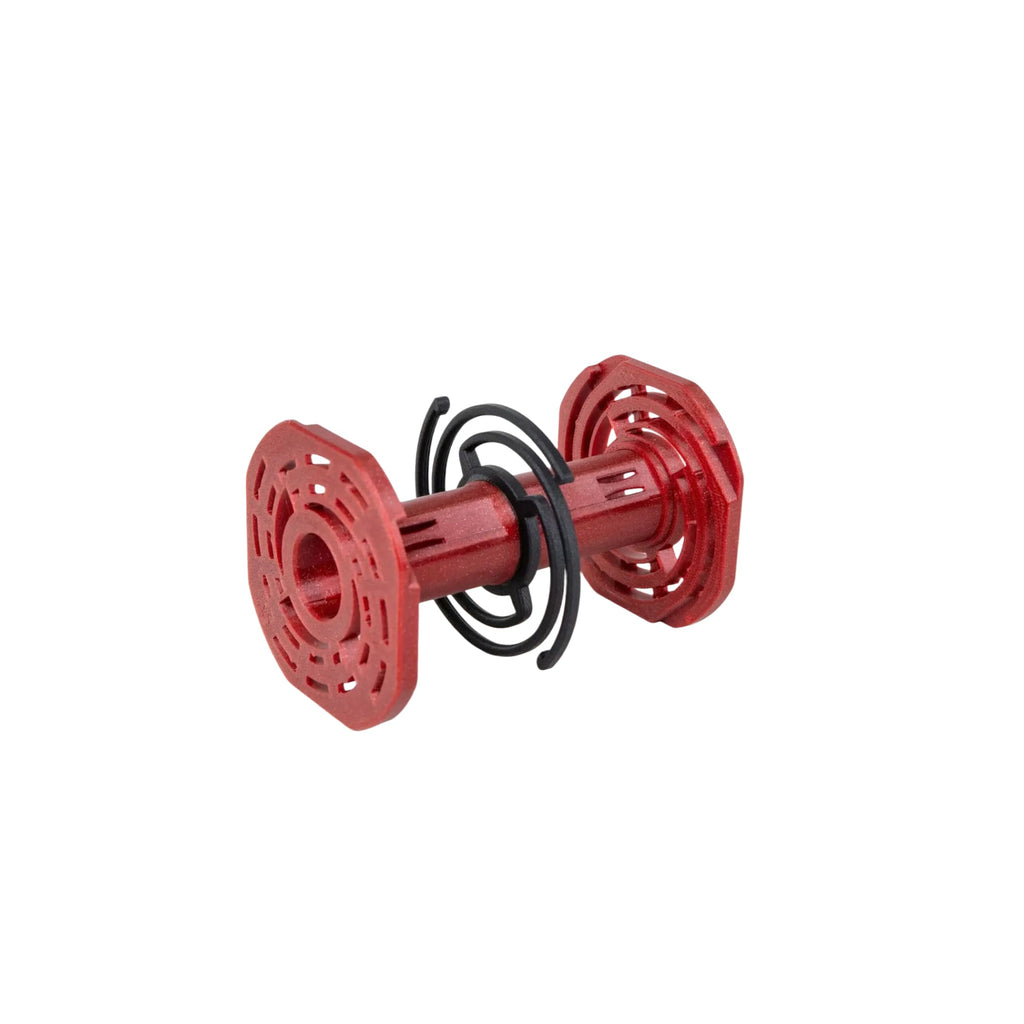 Red plastic toy with black spiral wire wrapped around its center.