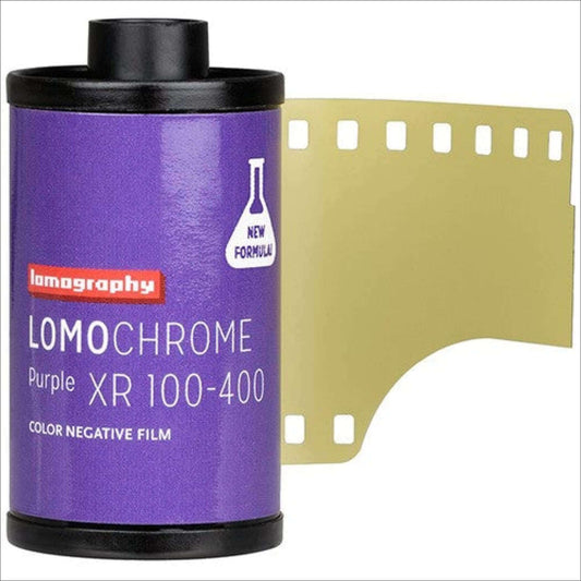 Lomography LomoChrome Purple XR 100-400 color negative film with new formula packaging and partially unrolled film strip