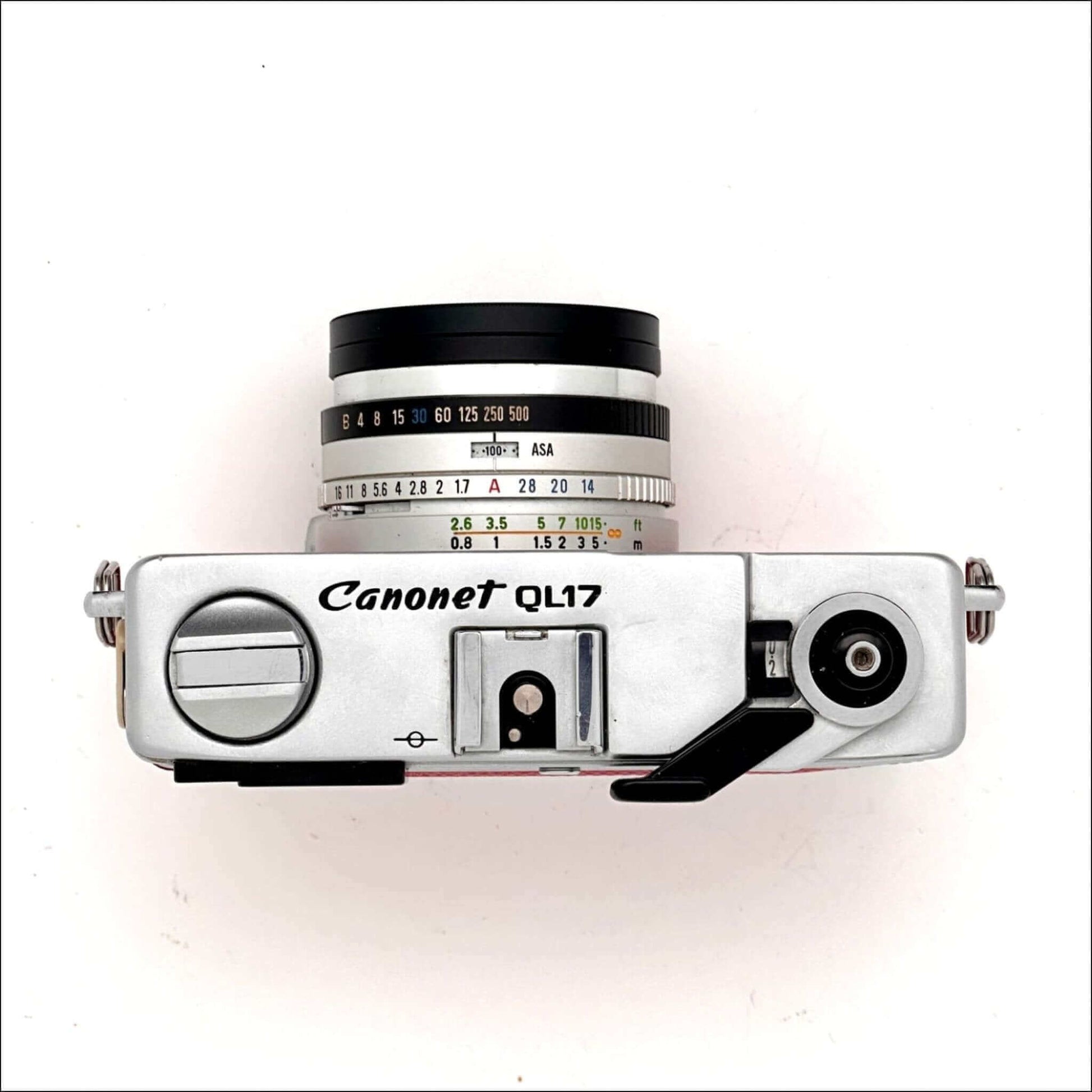 Top view of a Canonet QL17 vintage 35mm camera showing lens and control details.