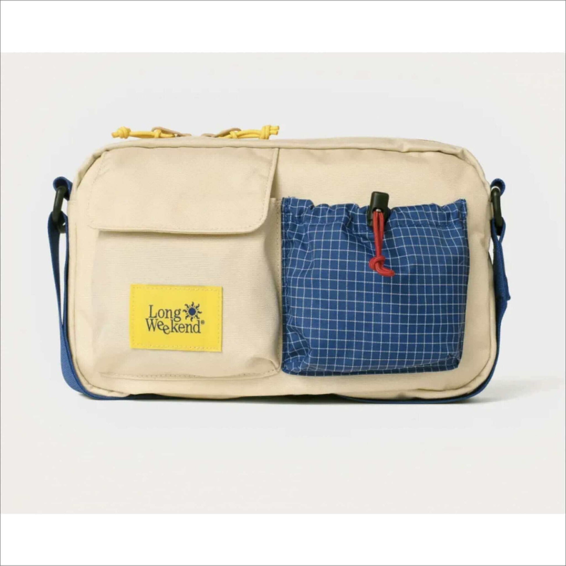 Beige and blue Long Weekend brand crossbody bag with pockets.